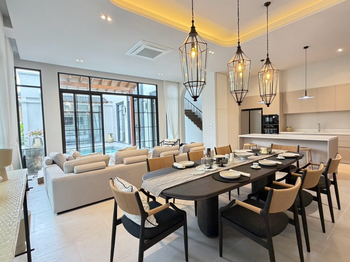 Dining table facing the pool courtyard