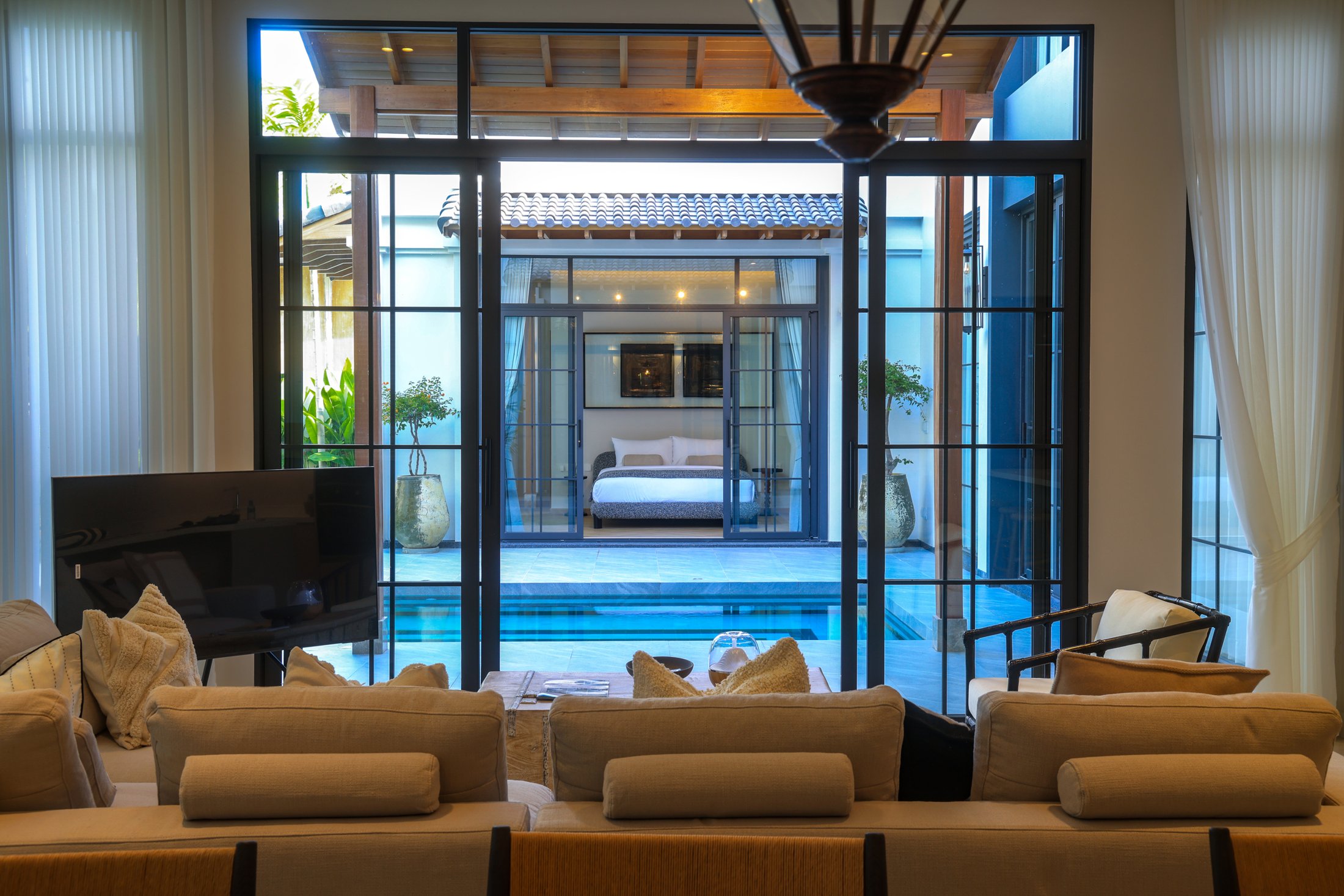 Actual Villa 04 living room looking towards the pool and courtyard